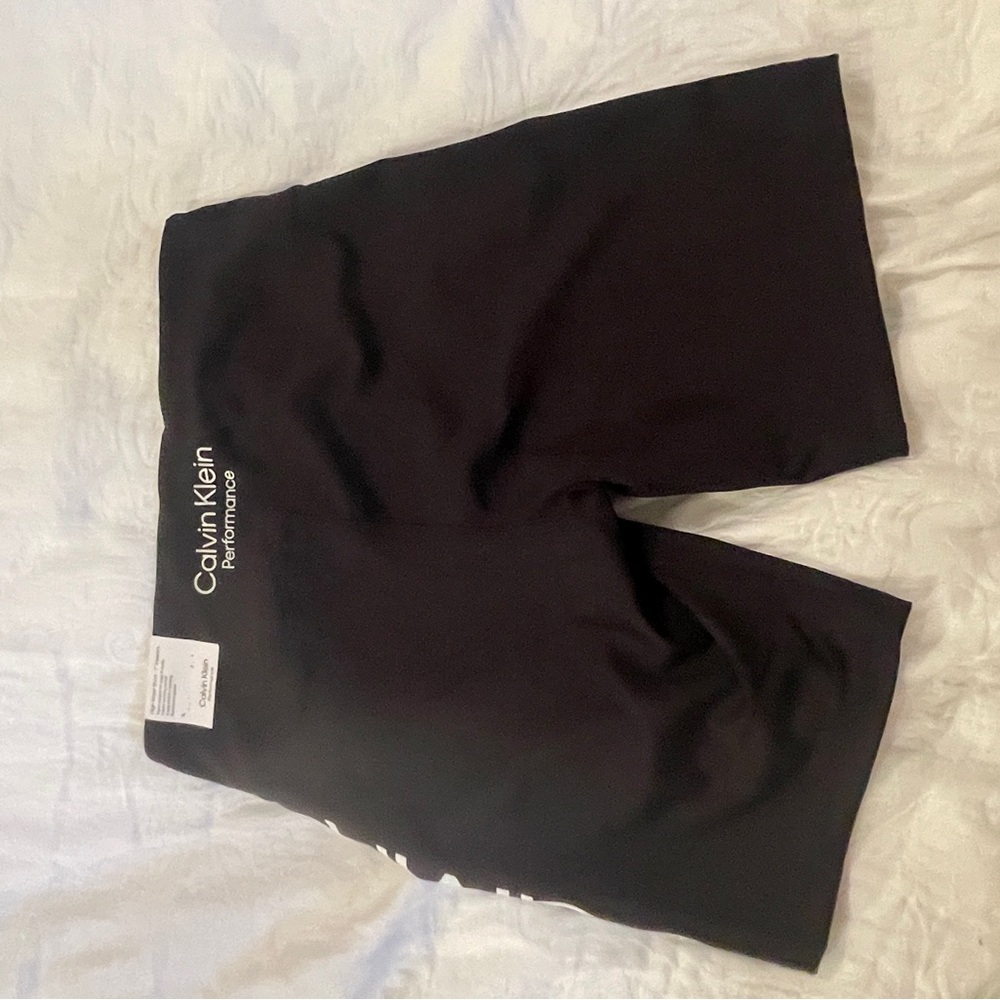 Black Calvin Klein performance shorts.